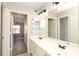 Bathroom featuring double sinks, modern fixtures and ample storage at 7725 Petrea Ln, Charlotte, NC 28227
