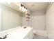 Bathroom with a double sink vanity, modern lighting and a shower and tub combo at 7725 Petrea Ln, Charlotte, NC 28227