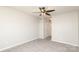Neutral bedroom with a ceiling fan, carpet flooring and a closet at 7725 Petrea Ln, Charlotte, NC 28227
