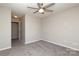 Bedroom with neutral walls, carpet, and ceiling fan at 7725 Petrea Ln, Charlotte, NC 28227