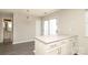 A dining area features a modern light fixture and access to an outdoor area at 7725 Petrea Ln, Charlotte, NC 28227