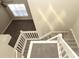 Bright foyer showcasing wood look flooring and staircase at 7725 Petrea Ln, Charlotte, NC 28227