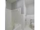Bathroom with tiled walls and floors and a white bathtub at 924 S Main Ave, Newton, NC 28658