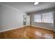 Bedroom with hardwood floors and bathroom access at 924 S Main Ave, Newton, NC 28658