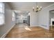 Open dining area showcasing hardwood floors and views into the modern kitchen at 924 S Main Ave, Newton, NC 28658