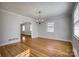 Bright dining room featuring hardwood floors and a traditional chandelier at 924 S Main Ave, Newton, NC 28658