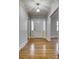 Bright foyer with gleaming hardwood floors and a stylish chandelier, showcasing the home's elegant entry at 924 S Main Ave, Newton, NC 28658