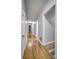 Hallway with hardwood floors and access to multiple rooms at 924 S Main Ave, Newton, NC 28658