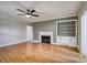A bright living room showcasing hardwood floors, fireplace, and built in bookcase at 924 S Main Ave, Newton, NC 28658
