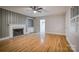 Spacious living room featuring a fireplace, hardwood floors, and built in bookcase at 924 S Main Ave, Newton, NC 28658