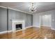 Comfortable living room with a fireplace and hardwood floors at 924 S Main Ave, Newton, NC 28658