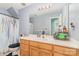Well-lit bathroom with a spacious vanity and a combination shower and tub at 10230 Blackstock Rd, Huntersville, NC 28078