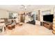 Spacious bonus room features cozy seating, a ceiling fan and multiple windows at 10230 Blackstock Rd, Huntersville, NC 28078