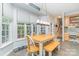 Bright dining area features a large window bay and modern chandelier at 10230 Blackstock Rd, Huntersville, NC 28078