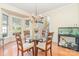 Charming dining room with a glass table, chandelier, and hardwood floors, perfect for entertaining at 10230 Blackstock Rd, Huntersville, NC 28078
