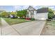 A well-maintained two-story home with a manicured lawn and a spacious driveway at 10230 Blackstock Rd, Huntersville, NC 28078