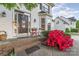 Close-up of the front porch with a decorative door, seasonal decorations, and inviting curb appeal at 10230 Blackstock Rd, Huntersville, NC 28078