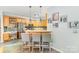 Eat-in kitchen boasts stylish bar seating and stainless appliances at 10230 Blackstock Rd, Huntersville, NC 28078