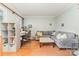 Spacious living room with hardwood floors, a comfortable sofa, and a functional workspace at 10230 Blackstock Rd, Huntersville, NC 28078