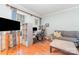 Inviting living room with hardwood floors, a comfortable sofa, and a functional workspace at 10230 Blackstock Rd, Huntersville, NC 28078