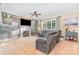 Cozy living room features fireplace, ceiling fan and plenty of natural light at 10230 Blackstock Rd, Huntersville, NC 28078
