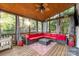 Inviting screened porch with comfortable seating and a ceiling fan at 10230 Blackstock Rd, Huntersville, NC 28078