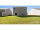 Spacious backyard featuring a well-maintained lawn, a sliding glass door, and vinyl siding at 1109 Foxberry Ln, Maiden, NC 28650