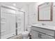 Bright bathroom featuring a glass enclosed shower, a vanity with a sink, and a toilet at 1109 Foxberry Ln, Maiden, NC 28650