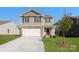 Charming two-story home with attached two-car garage, landscaped yard, and classic curb appeal at 1109 Foxberry Ln, Maiden, NC 28650