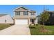 Charming two-story home with attached two-car garage, landscaped yard, and classic curb appeal at 1109 Foxberry Ln, Maiden, NC 28650