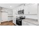 Modern kitchen with stainless steel appliances, granite countertops, and light gray cabinets at 1109 Foxberry Ln, Maiden, NC 28650