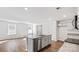 Bright, open kitchen with granite countertops, stainless steel appliances, and hardwood flooring at 1109 Foxberry Ln, Maiden, NC 28650