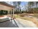 Expansive backyard with covered porch offers a serene outdoor living space at 1111 Barrington St, Wadesboro, NC 28170