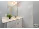 Bathroom featuring modern sink, faucet, mirror, and light fixture at 1111 Barrington St, Wadesboro, NC 28170