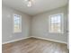 Spacious bedroom featuring modern flooring and natural light from two windows at 1111 Barrington St, Wadesboro, NC 28170