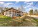 Angle view of attractive home showcasing porch, yard, and residential street at 1111 Barrington St, Wadesboro, NC 28170