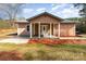 Inviting single-story home with stylish front porch at 1111 Barrington St, Wadesboro, NC 28170
