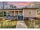 Charming home featuring a covered porch, landscaped yard, and inviting entrance at 1111 Barrington St, Wadesboro, NC 28170