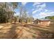 Charming home with a large front yard under a blue sky at 1111 Barrington St, Wadesboro, NC 28170