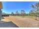 A wide expanse of lawn in a backyard with black metal fence and privacy trees at 11206 Grenfell Ave, Huntersville, NC 28078
