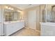 Bathroom featuring double vanity sinks and tiled shower at 11206 Grenfell Ave, Huntersville, NC 28078
