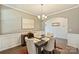 Elegant dining room with neutral tones, chandelier, and stylish furniture, ideal for gatherings at 11206 Grenfell Ave, Huntersville, NC 28078