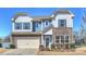 Charming two-story home with stone accents, a two-car garage, and manicured landscaping at 11206 Grenfell Ave, Huntersville, NC 28078