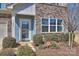 Close up of the front door of a well-maintained home with attractive landscaping at 11206 Grenfell Ave, Huntersville, NC 28078