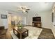 Bright living room featuring hardwood floors, modern ceiling fan, and ample natural light at 11206 Grenfell Ave, Huntersville, NC 28078