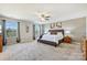 Spacious main bedroom featuring plush carpet, ample natural light, and ceiling fan at 11206 Grenfell Ave, Huntersville, NC 28078