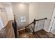 Staircase with decorative iron railings and hard wood steps at 11206 Grenfell Ave, Huntersville, NC 28078