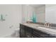 Bright bathroom featuring a double sink vanity with granite counters and chrome faucets at 12018 Grey Partridge Dr, Charlotte, NC 28278