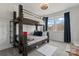 Charming bedroom featuring a bunk bed and a modern ceiling fan at 12018 Grey Partridge Dr, Charlotte, NC 28278