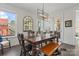 Bright dining room featuring a stylish light fixture and an eye-catching rustic wood bench at 12018 Grey Partridge Dr, Charlotte, NC 28278